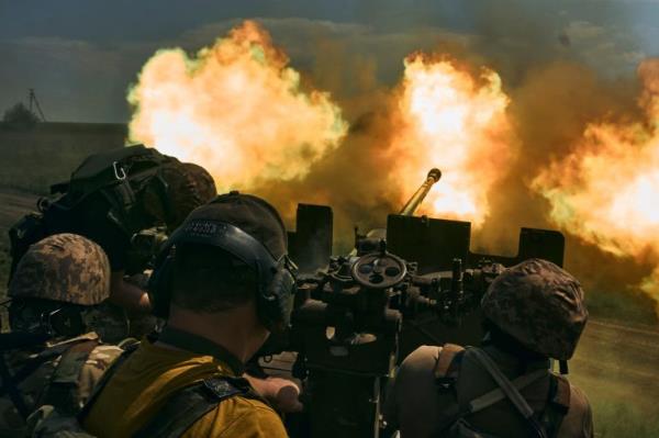 Ukrainian soldiers fire a cannon near Bakhmut, an eastern city where fierce battles against Russian forces have been taking place, in the Donetsk region, Ukraine, May 15, 2023